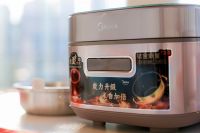 2023国际米食味品鉴大会召开 美的赤炎炭火电饭煲助力甄选优质好大米